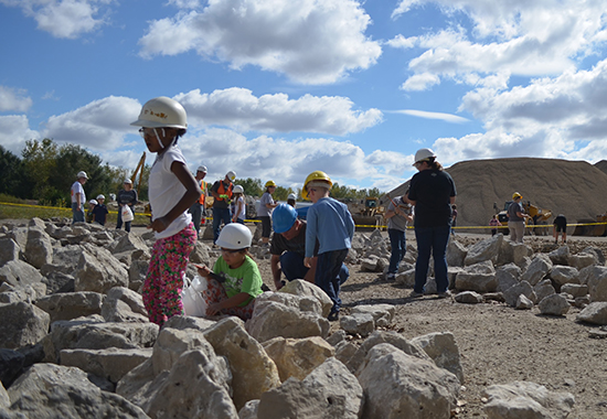 Link to Earth Science Education week, Image of Sunday at the Quarry participants collecting rocks and looking for fossils in the children's 'dig' area.